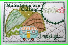 an embroidered patch with the words mountains are calling and a small camper on it