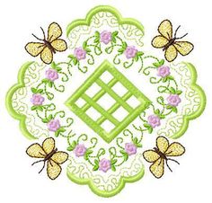 a circular design with butterflies and flowers in the center on a white background, surrounded by green lace