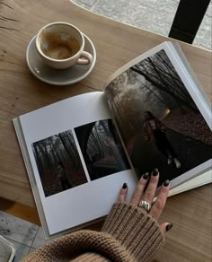 a woman is reading a book and drinking coffee