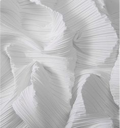 an abstract photo of white pleated fabric