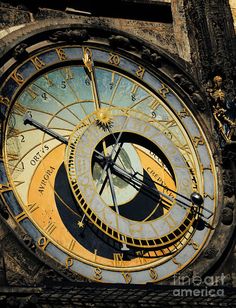 a large clock with roman numerals on it's face and numbers in the middle