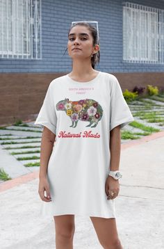 This T-Shirt Dress features a unique Capybara design made out of flowers with the text 'South America's Finest, Natural Made'. It gives off a fun and vibrant vibe, perfect for casual outings or relaxed days. Ideal for women who appreciate nature and cute animal designs, this dress is relevant for Earth Day, nature lovers, and animal enthusiasts. Product features - 100% Polyester fabric for durability - Side seams for structural support - Self fabric binding for a cohesive look - Lightweight mate Tshirt Dress Pattern, Womens T Shirt Dress, Relaxing Day, Gifts For Pet Lovers, Floral Print Dress, Dress Pattern, Girls Tshirts, Urban Fashion, T Shirt Dress