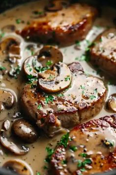 some meat and mushrooms are cooking in a pan