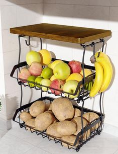 two tiered fruit and vegetable rack with potatoes, apples, pears, bananas