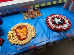 patriotic desserts are displayed on a blue table