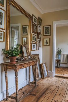 a wooden table sitting in front of a mirror on top of a hard wood floor