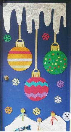 a door decorated with christmas ornaments and snow