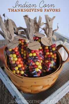 a basket filled with lots of candy covered in brown paper bags and tied to twine