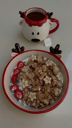 a bowl of oatmeal with strawberries and chocolate