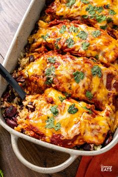 a casserole dish with meat and rice topped with cilantro