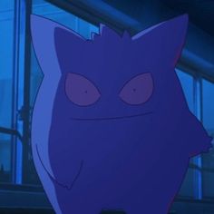 an evil looking cat with big eyes standing in front of a window at night time