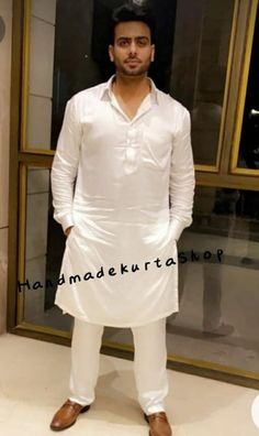 "HANDMADEKURTASHOP  Description Man kurta for Man Give yourself a best ethnic look by wearing this Top and bottom Set. Made of rich cotton silk blend fabric this regular-fit set comprises a full-sleeved Indian kurta This outfit with mojris will look apart on special occasions. material 100%Cotton Color : White color Kurta Length : 40 inches Only kurta not pajama Shirt Chest is measurement for shirt (not body) As per standard, for best loose fitting 6 inches gap should be there between actual che White Naqshi Kurta For Diwali, White Dabka Churidar For Puja, White Straight Kurta With Naqshi Details, White Straight Kurta With Naqshi, Fitted Long Sleeve Kurta For Puja, Transitional White Kurta For Puja, White Bollywood Tunic Kurta, White Long Sleeve Churidar For Puja, White Dabka Kurta For Diwali