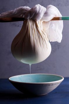 a bowl with some food in it and a spoon sticking out of the top one