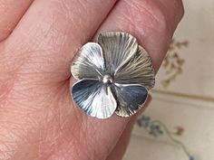 This item measures approximately :- uk size - 'O' usa size - '7.5' Ring has expandable 'open' band ....could go up approximately another full size. The ring face measures approximately 2.1cms in diameter. It weighs approximately - 3.82gms. Fabulous unusual vintage sterling silver 'pansy' flower statement ring.  Its marked 'sterling' for sterling silver ....also professionally tested.  Please see photos for more accurate description. Any wear and tear consistent with the age of the item. P&P can The Ring Face, Pansy Flower, Pansies Flowers, Pansies, Statement Ring, Rings Statement, Vintage Sterling Silver, Favorite Jewelry, Statement Rings