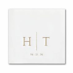 a white square with the letter h and two smaller letters on it, in gold