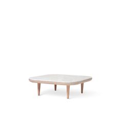 the table is made from wood and has a white marble top, with wooden legs