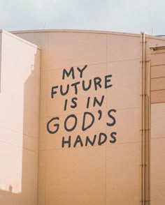 graffiti on the side of a building that says my future is in god's hands