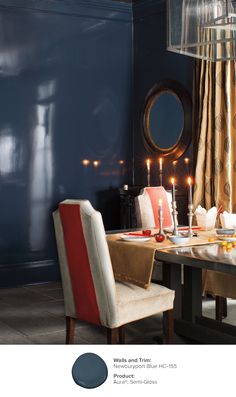 a dining room table with two chairs and candles in the center, on instagram