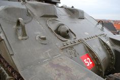 an old tank with a red tag on it