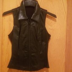 Nwt Leather Vest Black. Zip Up Front. Soft Leather On Front. Nice Black Cotton Back. Classic Black Leather Vest, Classic Leather Vest With Button Closure, Black Leather Vest With Pockets, Leather Biker Vest Sleeveless, Sleeveless Leather Vest With Button Closure, Leather Vest, Black Cotton, Soft Leather, Zip Ups