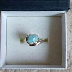 Larimar Is A Rare Blue Variety Of The Silicate Mineral Pectolite Found Only In The Dominican Republic, In The Caribbean. Its Coloration Varies From White, Light-Blue, Green-Blue To Deep Blue. This Gorgeous Ring Is Simple And Elegant. Elegant Blue Larimar Turquoise Ring, Elegant Blue Larimar Rings, Blue Larimar Opal Ring, Blue Larimar Cabochon Rings, Blue Larimar Jewelry For Anniversary, Silver Larimar Turquoise Ring For Anniversary, Silver Turquoise Larimar Ring For Anniversary, Elegant Turquoise Larimar Ring As Gift, Elegant Turquoise Moonstone Ring In Sterling Silver