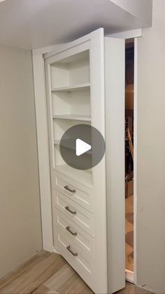 an open closet with drawers in the corner