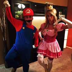 two people dressed up as mario and princess peach