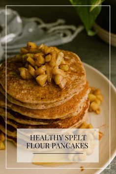 stack of pancakes with nuts on top and text overlay that reads healthy split flour pancakes