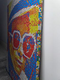 there is a colorful mosaic on the wall