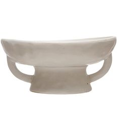 a white bowl sitting on top of a table