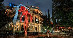 a building decorated with lights and decorations at night