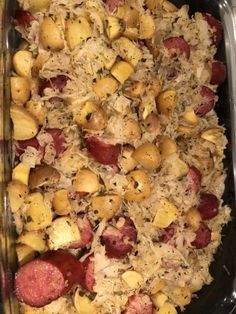 a casserole dish with potatoes and meat in it