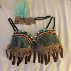 two bras with feathers and beads on them