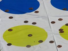 a close up of a paper bag with coins on it and circles painted on it