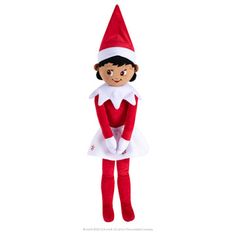 the elf doll is wearing a white dress and red shoes with her hands on her hips