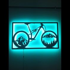 a neon sign with a mountain bike on it