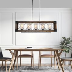 a dining room table with chairs and a chandelier hanging from it's ceiling