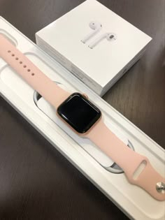 an apple watch sits in its box on the table