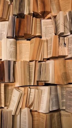 many books stacked together with the words let there be love