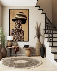 a living room filled with vases and a painting on the wall next to a stair case