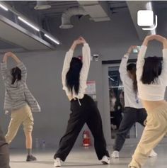 several people are dancing in a dance studio