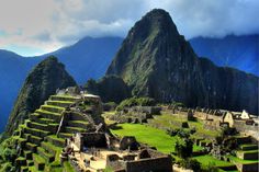 the ruins of machaca picach are surrounded by mountains