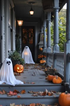 halloween decorations on the front steps of a house