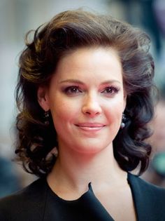 a close up of a person wearing a black dress