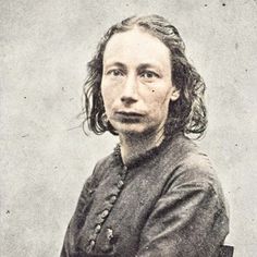 an old black and white photo of a woman