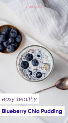 a bowl of blueberry chia pudding next to a spoon