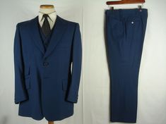 "In Excellent Vintage condition *Brand: Gino di Balti *Tailored in USA *Color: Blue, stripe *Style: c.1970, Single Breast, Two front buttons, Medium weight material *Pants : Flat front, No cuff *Jacket Measurement 17 1/4\" Shoulder 21 1/4\" Pit to pit 23 1/4\" Sleeve 29 1/2\" Length at back *Vest Measurement 11 3/4\" Shoulder 20 1/2\" Pit to pit 19 1/2\" Length at back *Pants Measurement 18 1/2\" Pit to pit at waist -Laid flat 11 1/4\" Rise 28 3/4\" Inseam length 13 1/4\" Leg opening 8 3/4\" Wid Classic Blue Three-piece Suit With Pockets, Classic Blue Three-piece Suit, Fitted Vintage Blue Set, Blue Fitted Vintage Set, Fitted Vintage Blue Suits, Vintage Fitted Blue Suits, Blue Fitted Vintage Suit, Retro Fitted Blue Sets, Retro Blue Fitted Sets