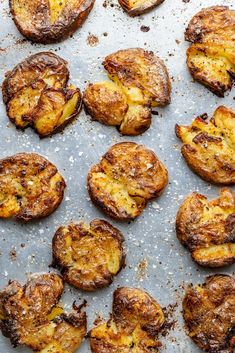 baked potatoes on a baking sheet covered in powdered sugar