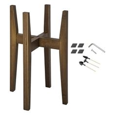 a small wooden table with tools on it