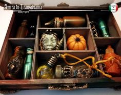 an open wooden box filled with lots of different items